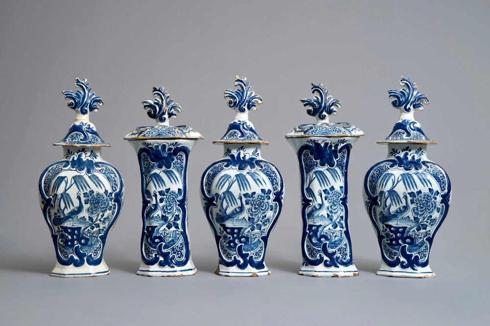 A Dutch Delft blue and white five-piece garniture with birds of paradise, 18th C.