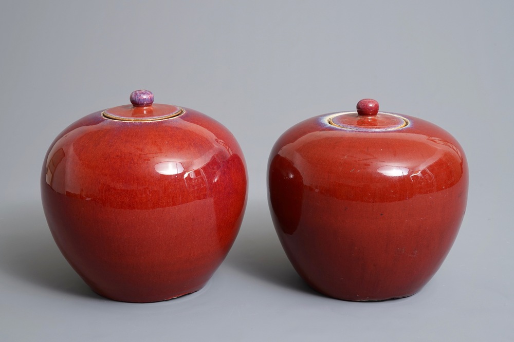 A pair of Chinese monochrome oxblood-glazed jars and covers, 19th C.