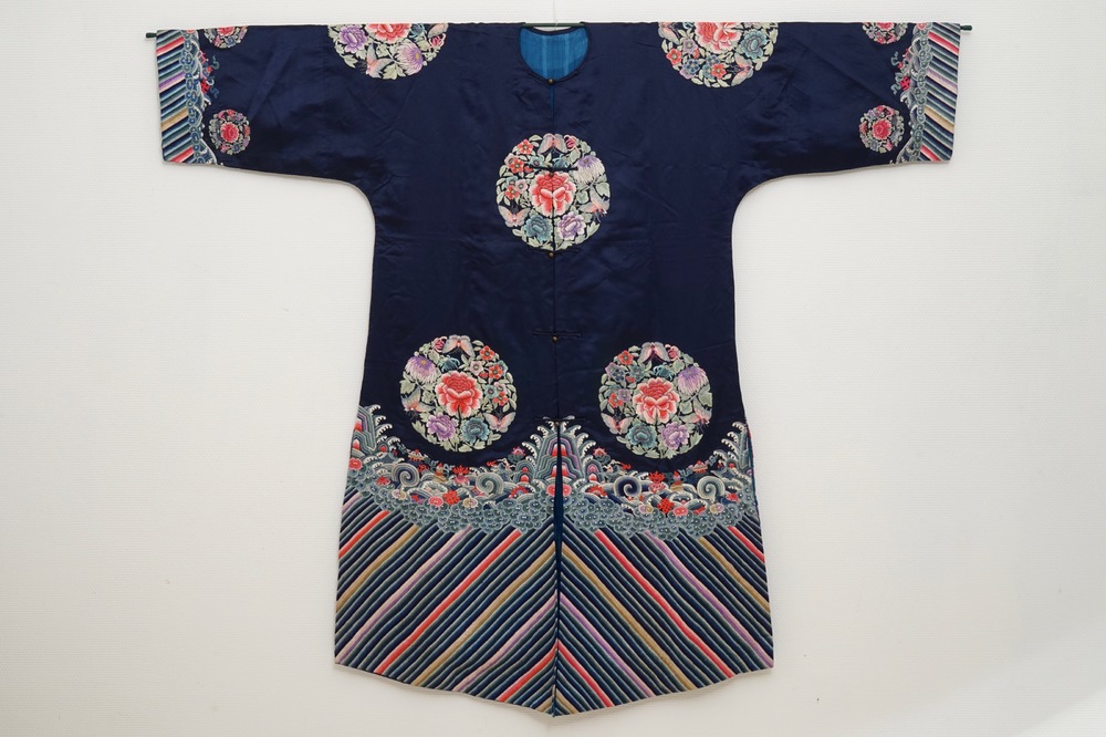 A Chinese blue ground silk informal woman's robe, 19th C.