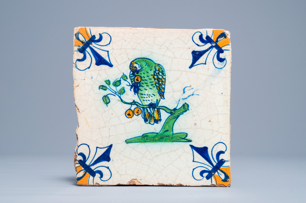 A polychrome Dutch Delft tile with a parrot, 1st half 17th C.