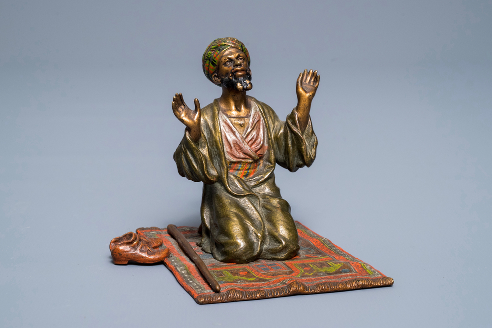 A cold-painted bronze group of a praying muslim, Vienna, signed Bergman, late 19th C.