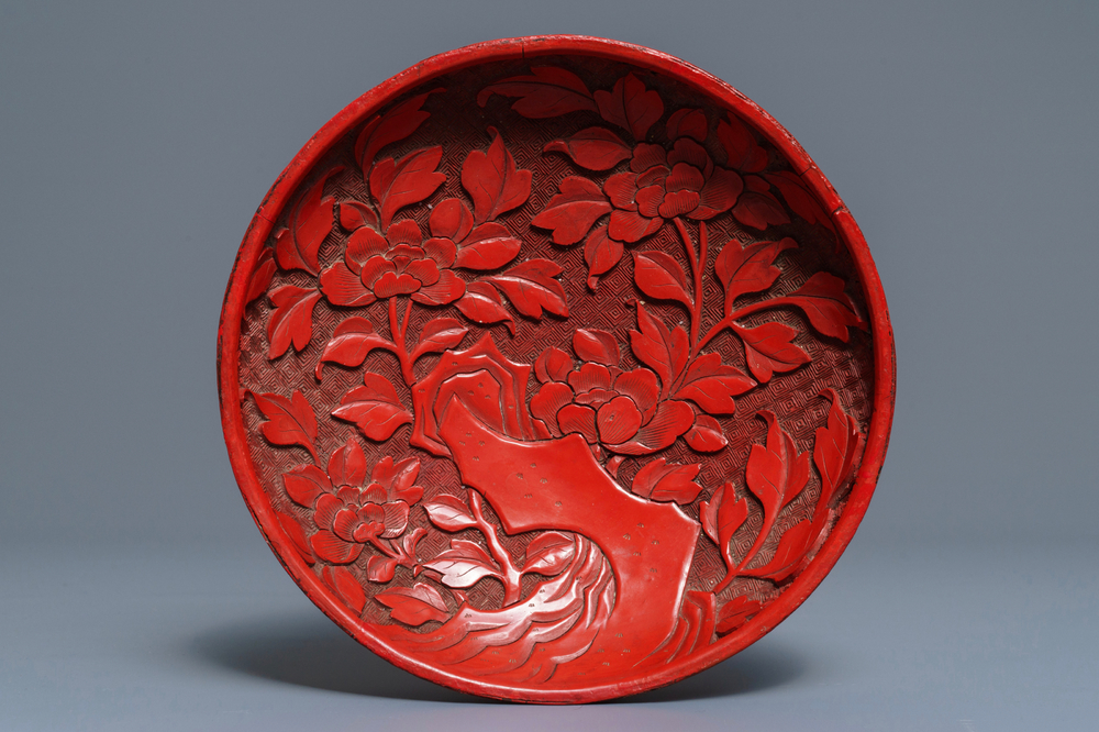 A Chinese cinnabar lacquer dish with floral design, 18/19th C.