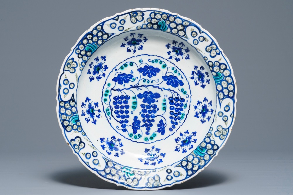 An Iznik 'grapevine' dish in blue and green, Turkey, 3rd quarter 16th C.