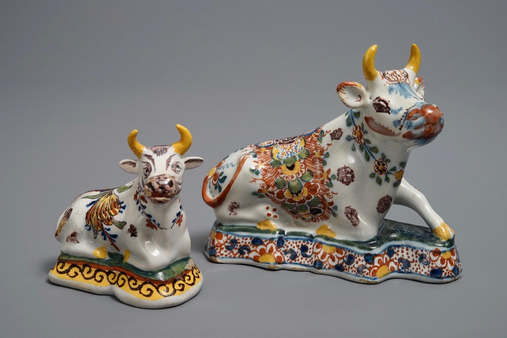 Two polychrome Dutch Delft models of recumbent cows, 18th C.