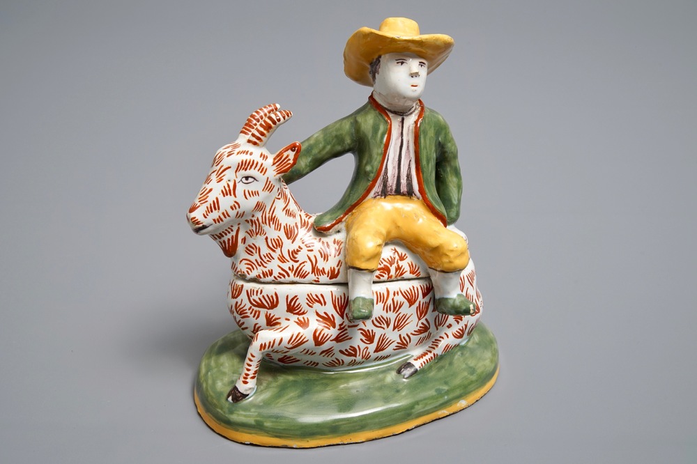 A polychrome Dutch Delft-style butter tub and cover in the shape of a buckrider, prob. D&egrave;svres, France, ca. 1900