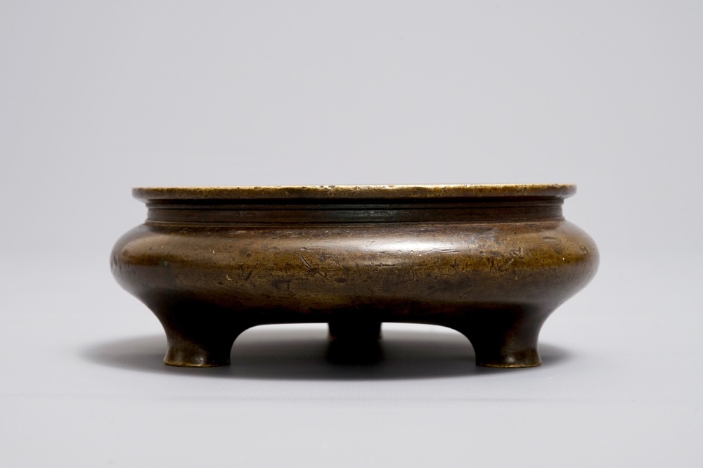 A Chinese bronze tripod censer, Xuande mark, Ming