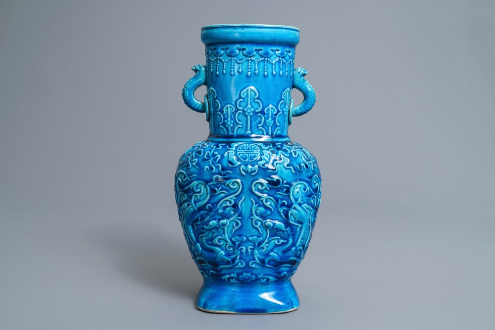 A Chinese turquoise-glazed vase with applied design, 18/19th C.