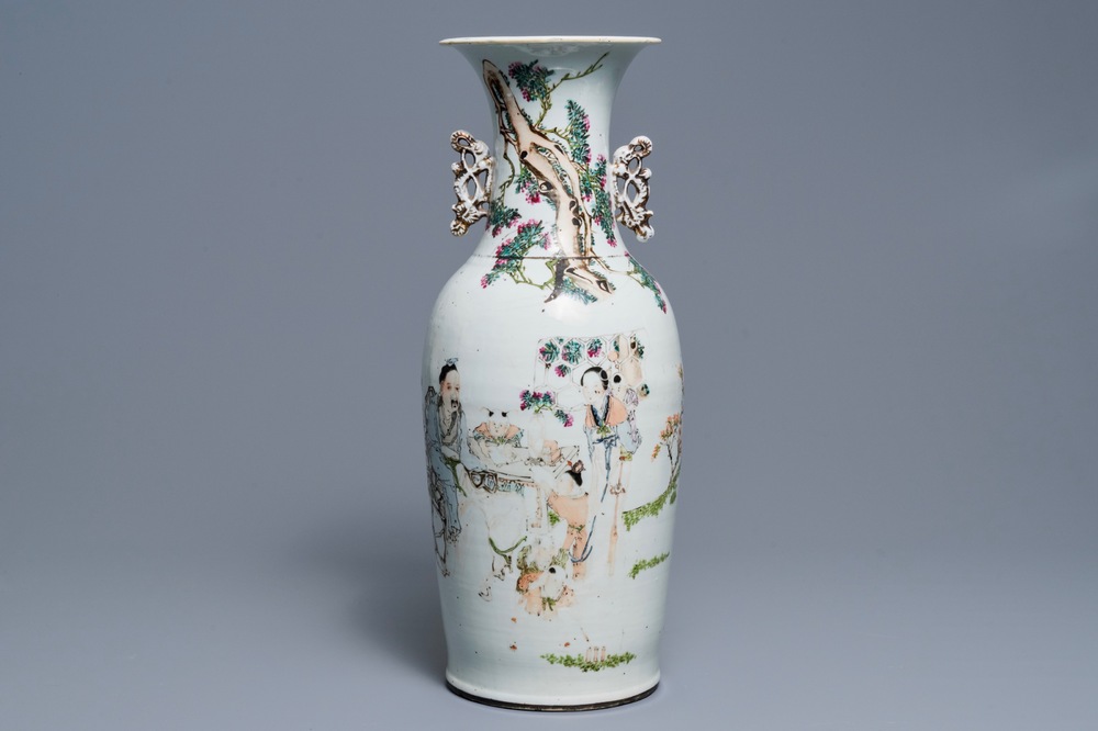 A Chinese qianjiang cai vase with figures around a table, 19th C.