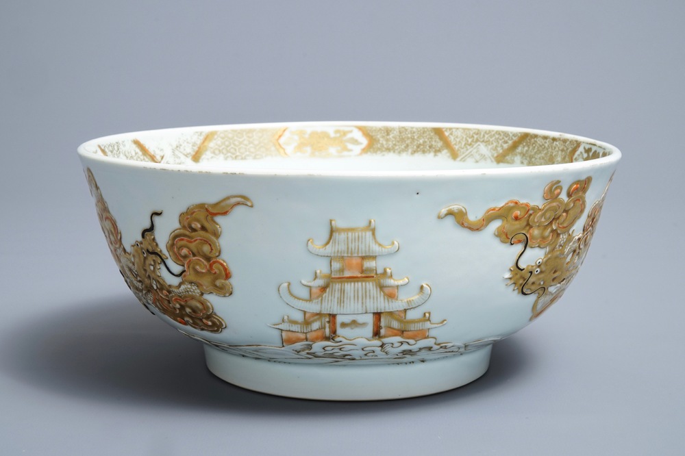 A Chinese gilt-decorated relief-moulded 'dragons and carps' bowl, Kangxi/Yongzheng
