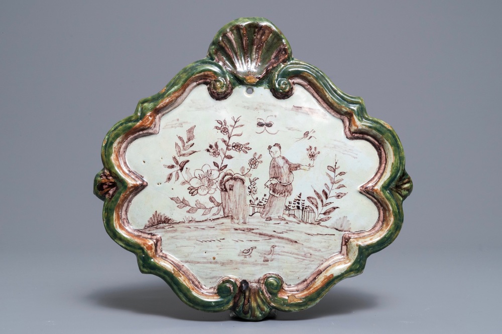A polychrome Dutch Delft green and manganese plaque, 18th C.