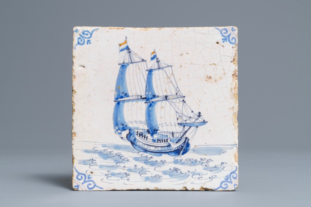 A Dutch Delft blue and white 'two-master with Dutch flag' tile, Harlingen, 17th C.