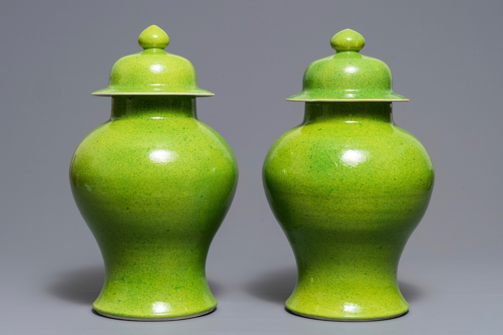 A pair of Chinese yellow and green-glazed vases and covers, 19th C.