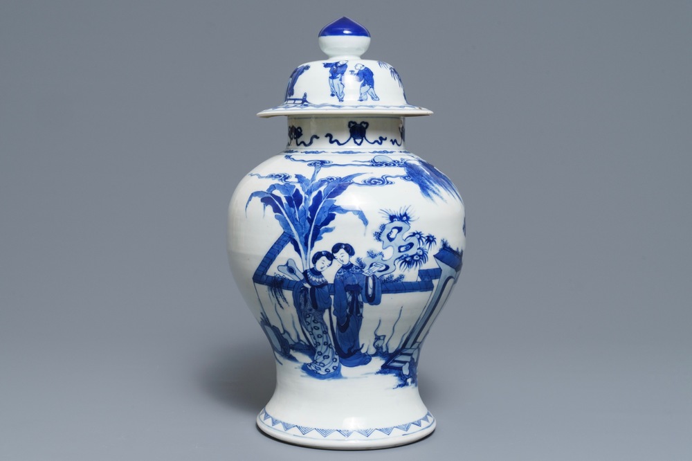 A Chinese blue and white vase and cover with ladies in a garden, 19th C.