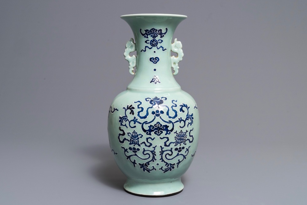 A Chinese blue and white on celadon ground 'buddhist emblems' vase, Qianlong mark and of the period
