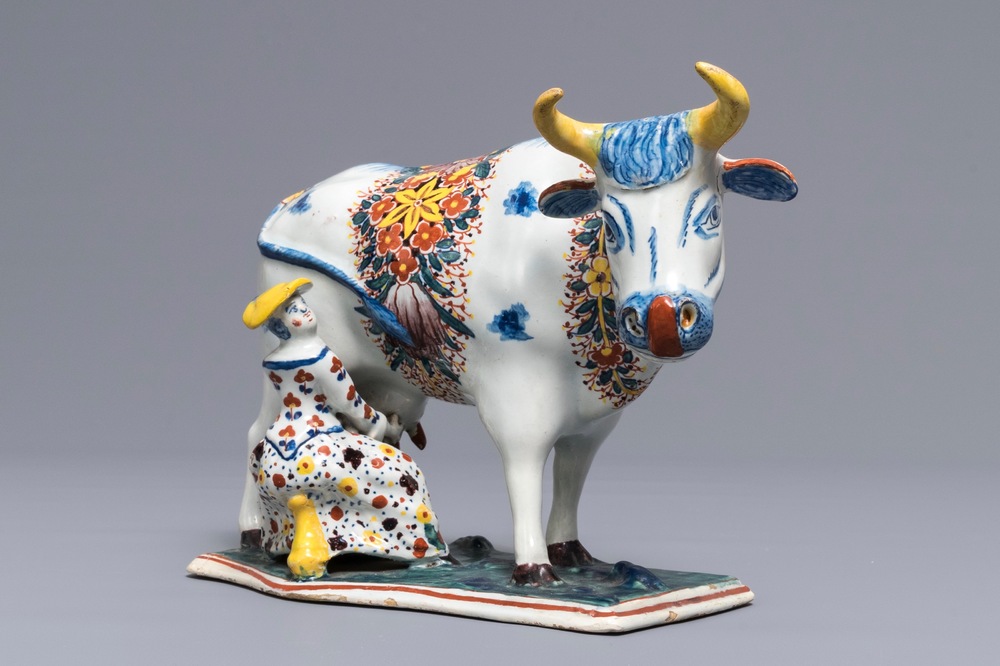 A large Dutch Delft polychrome cow milking group, 18th C.