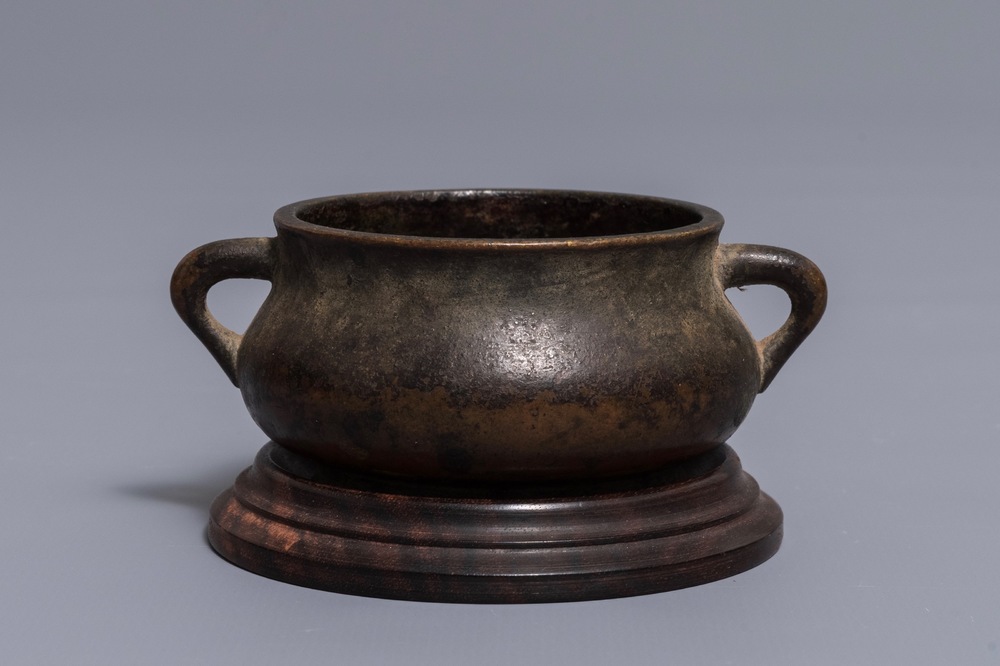 A Chinese gold-splashed bronze incense burner, Xuande mark, 18th C.