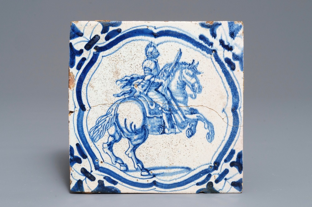 A large Dutch Delft blue and white 'horserider' tile made for the French Chateau de Beauregard, ca. 1627