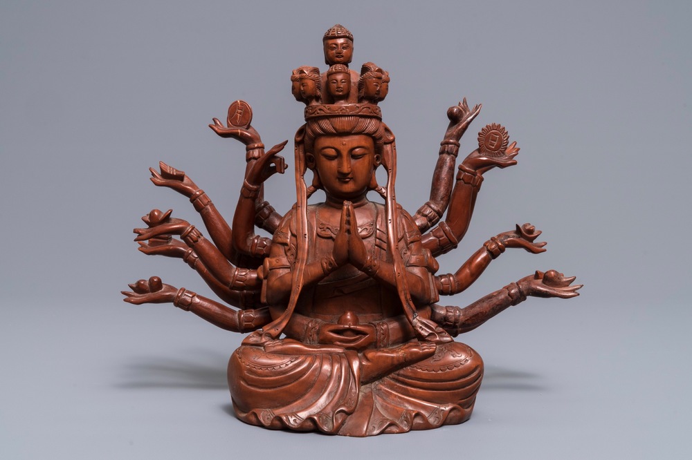 A Chinese huangyang wood figure of the 12-armed Guanyin, Republic, 20th C.