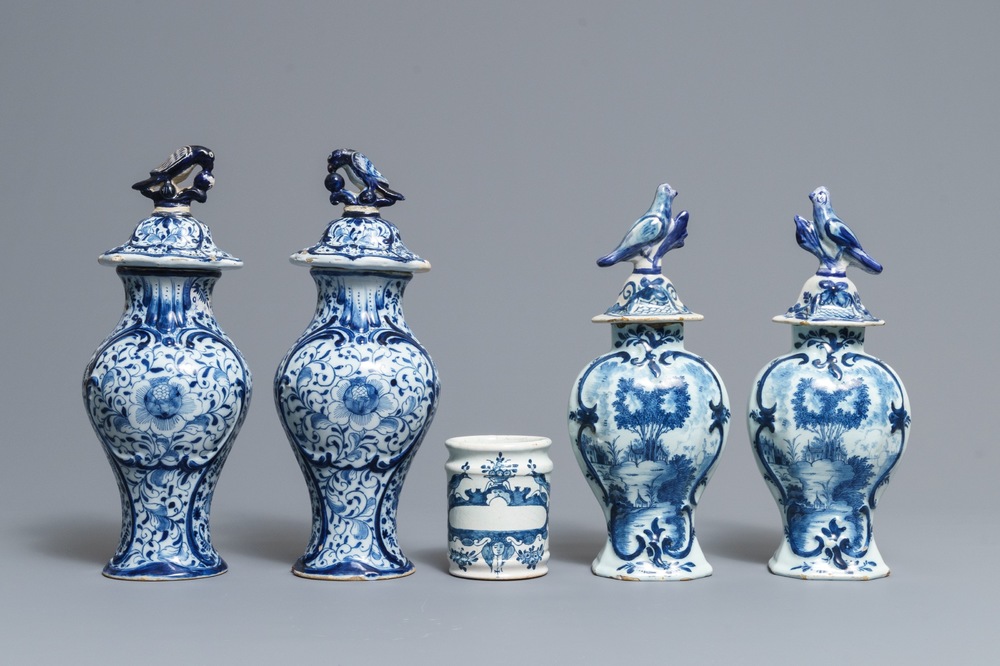 Two pairs of Dutch Delft blue and white covered vases and a drug jar, 18th C.