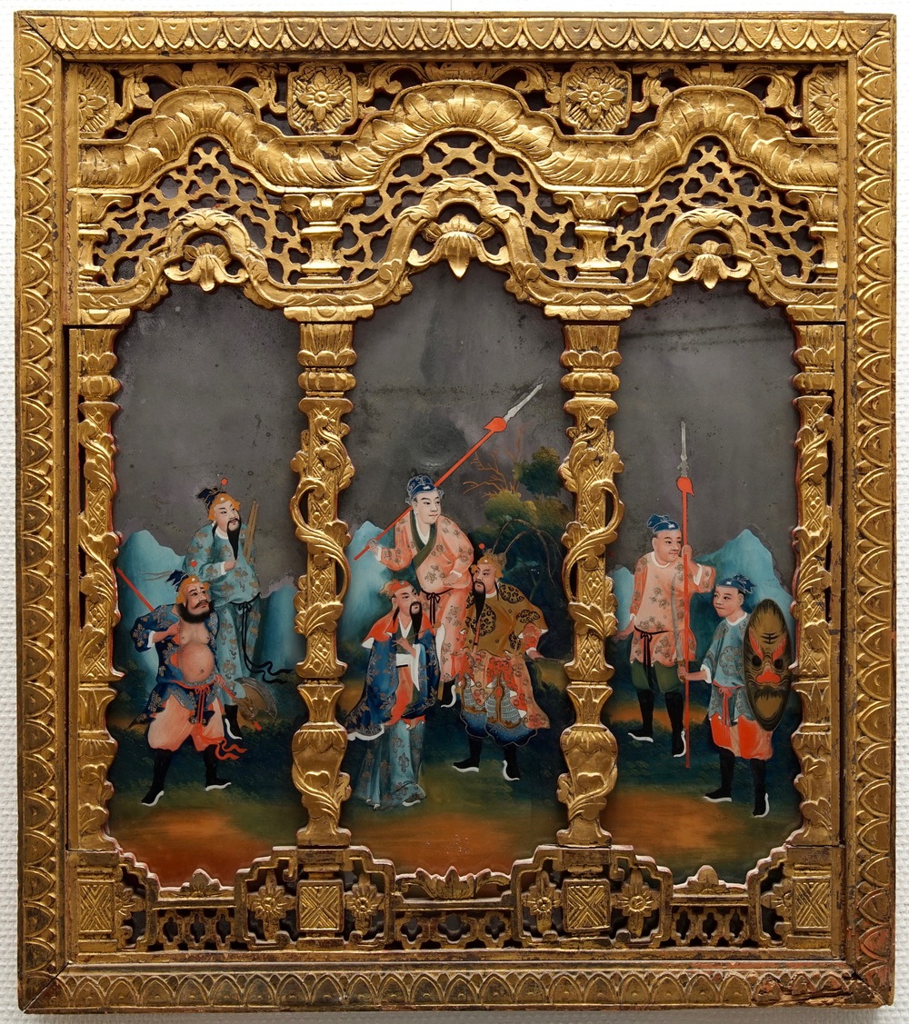 A rare Chinese gilt wood and reverse glass painted mirror, 2nd half 18th C.