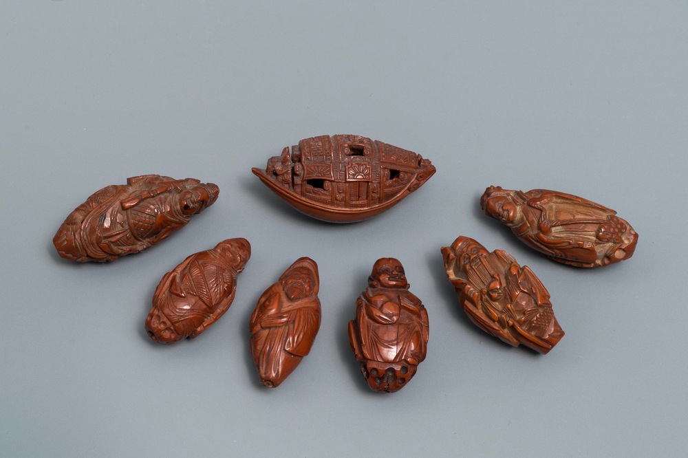 Seven Chinese carved olive pits, Republic, 20th C.