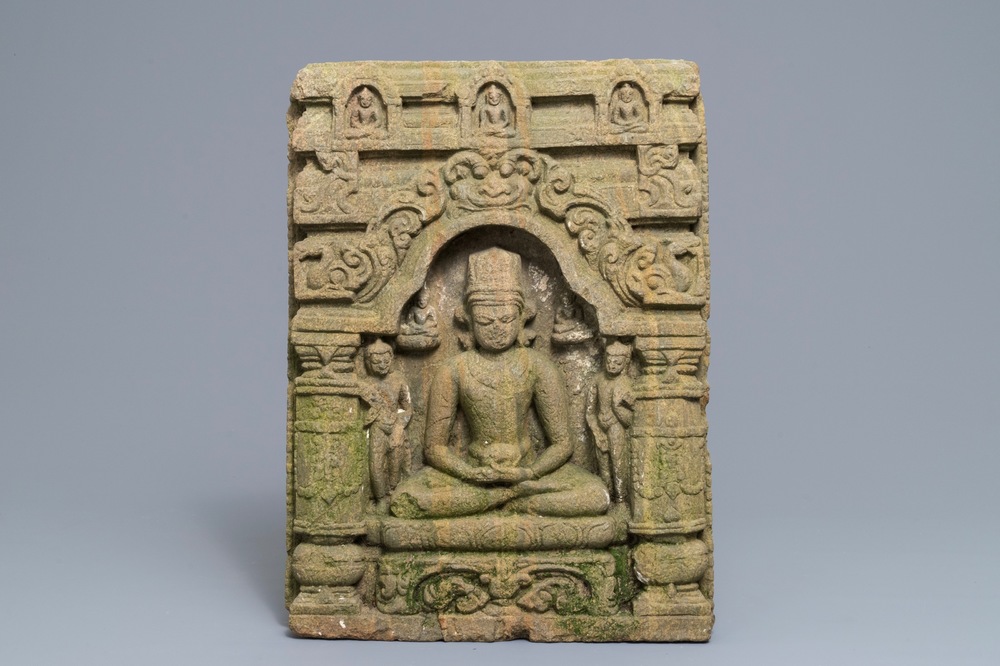 A sandstone relief depicting the seated Buddha in a temple, India, 12/13th C.