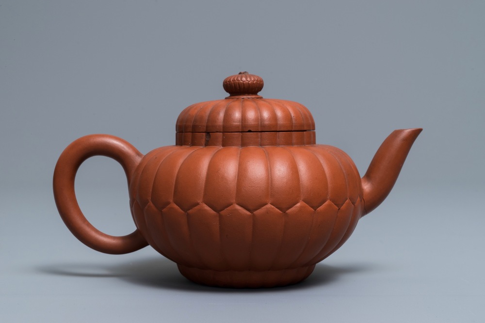 A Chinese Yixing stoneware 'chrysanthemum' teapot and cover, Kangxi