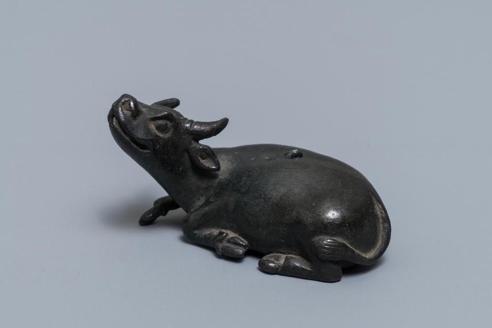 A Chinese bronze water dropper in the shape of a buffalo, two-character mark, Ming