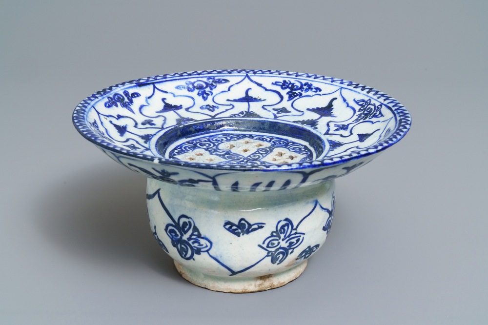 A large blue and white fritware spittoon or strainer, Qajar, Iran, 19th C.