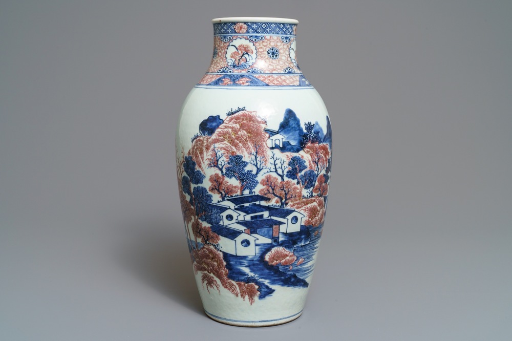 A Chinese blue, white and underglaze red landscape vase, 19th C.