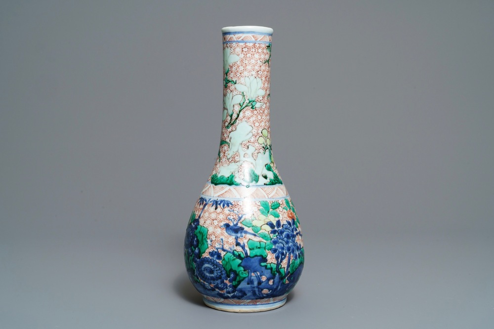 A Chinese wucai bottle vase with birds in a garden, Transitional period