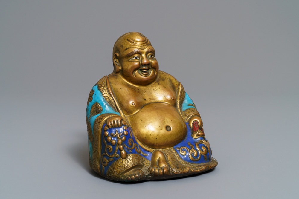 A Chinese champlev&eacute; enamelled copper figure of Buddha, Qianlong