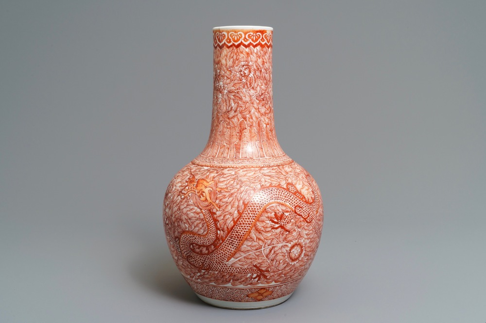 A Chinese iron red 'dragon and phoenix' bottle vase, 19th C.