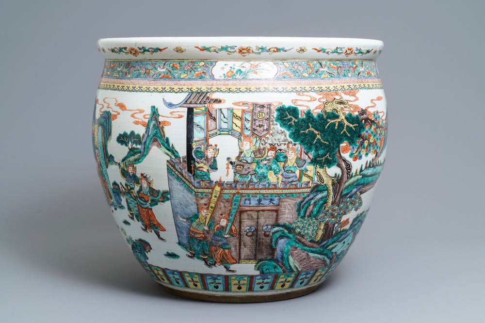 A large Chinese famille verte fish bowl with a narrative scene all-round, 19th C.