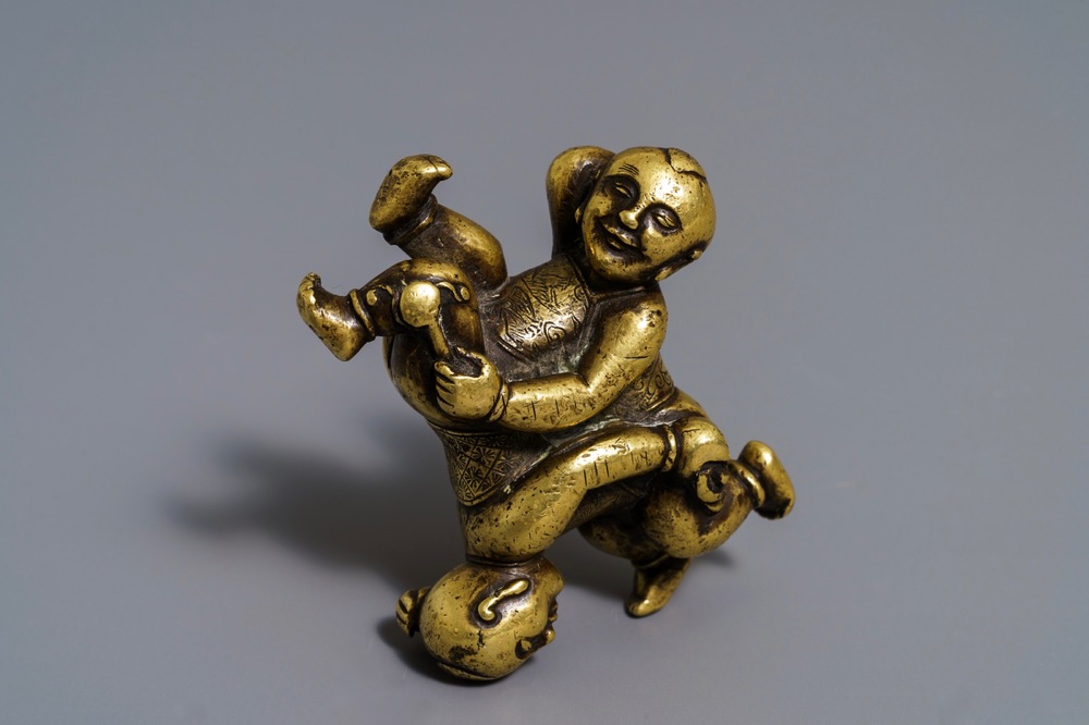 A Chinese gilt bronze Hoho brothers scroll weight, 18/19th C.