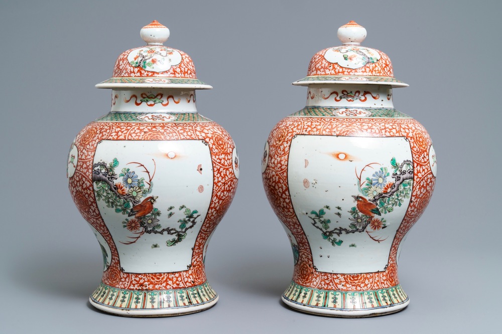 A pair of Chinese famille verte vases and covers, 19th C.