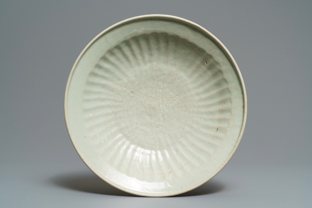 A Chinese Swatow celadon slip-decorated dish, Ming