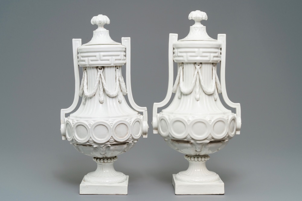 A pair of tall neoclassical Sevres-style covered vases, France or Germany, 18/19th C.