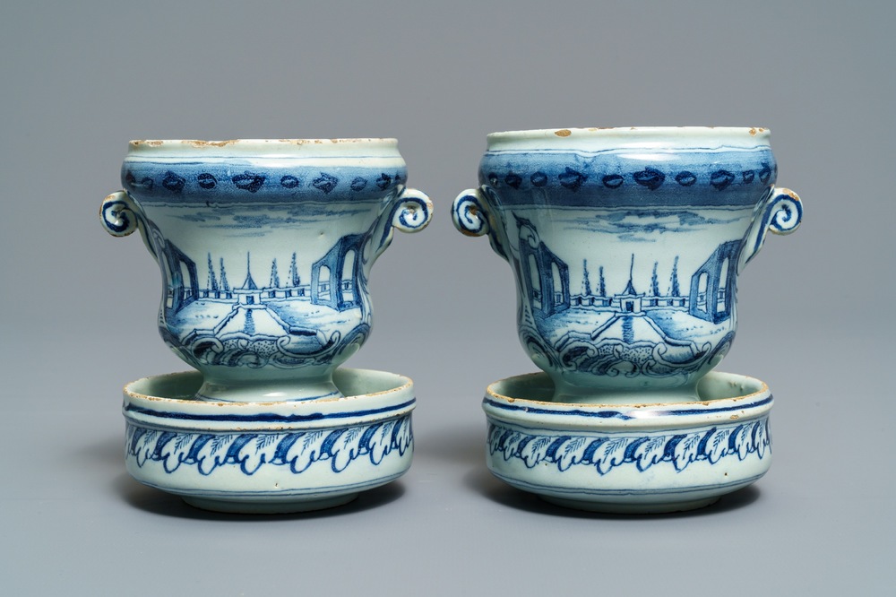 A pair of small Dutch Delft blue and white 'campana' vases on stands, 18th C.
