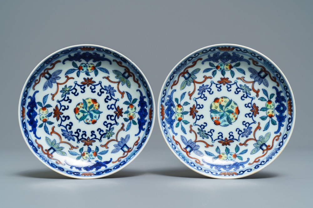 A pair of Chinese doucai plates with peaches, Qianlong mark, 19th C.
