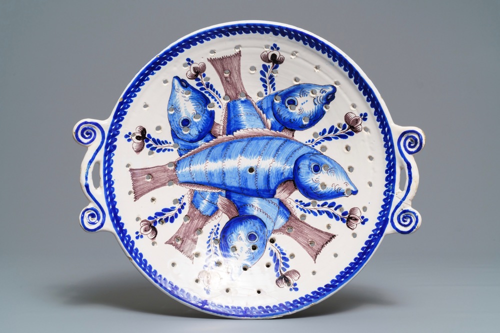 A large blue and manganese Frisian Delft fish strainer, Tichelaar, Makkum, 19th C.