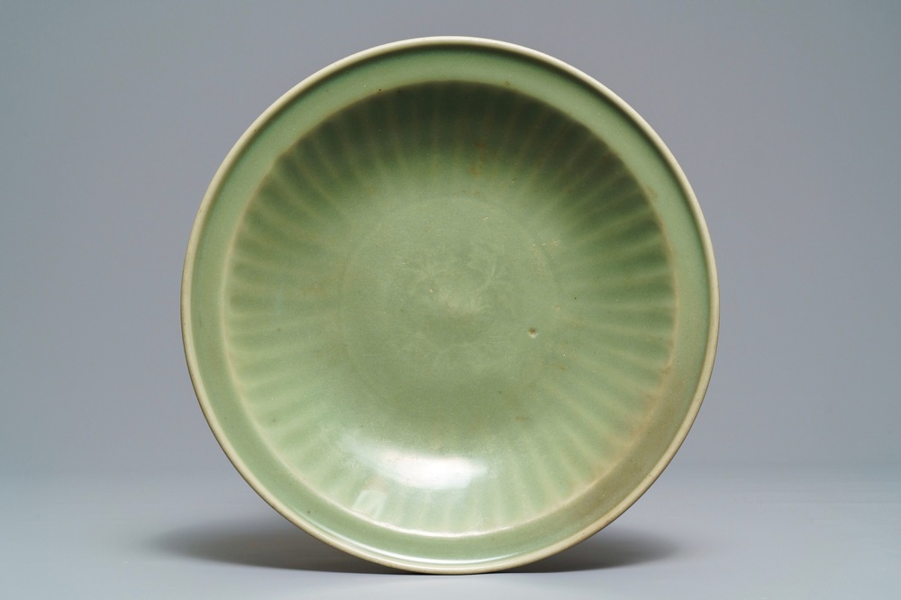 A Chinese Longquan celadon dish with underglaze design, Ming