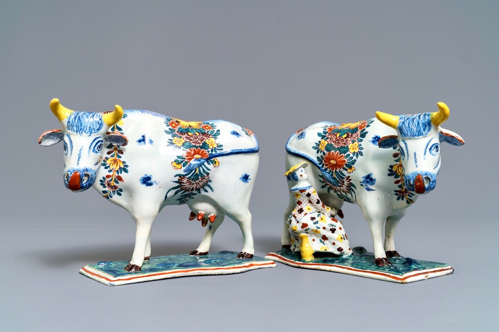 Two polychrome Dutch Delft models of cows on bases, 18th C.