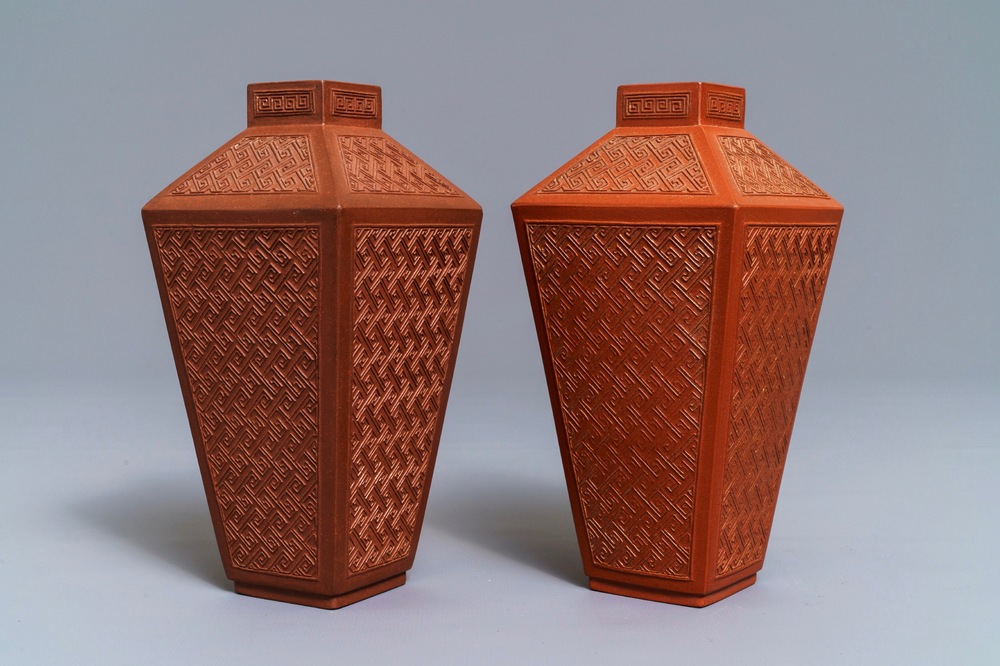 A pair of Chinese Yixing stoneware relief-decorated tea caddies, seal mark, 18th C.