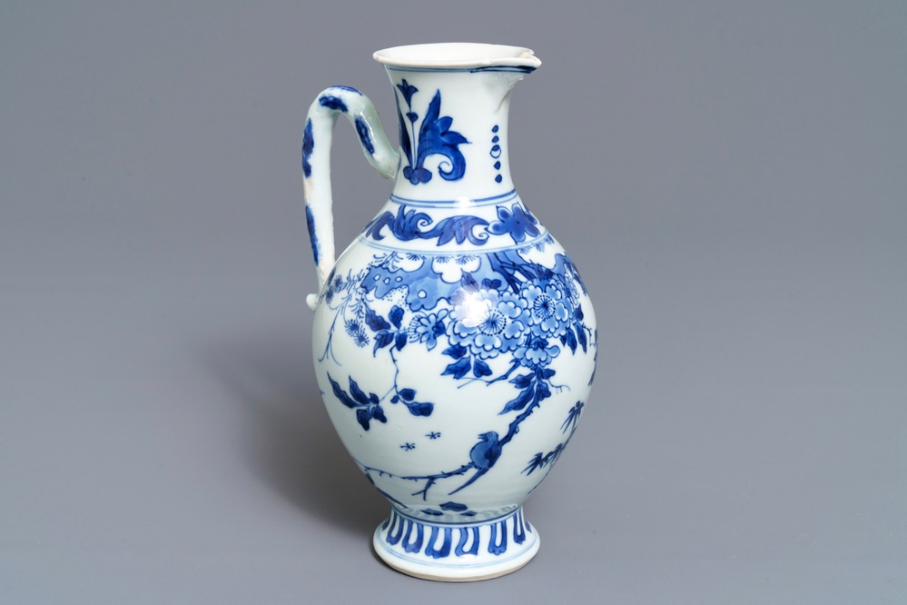 A Chinese blue and white jug with floral design, Transitional period