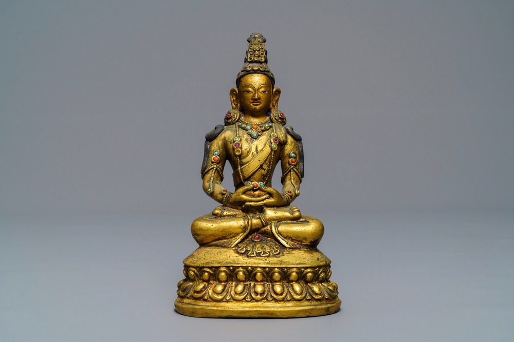 A Sino-Mongolian inlaid gilt bronze figure of Amitayus, 18/19th C.