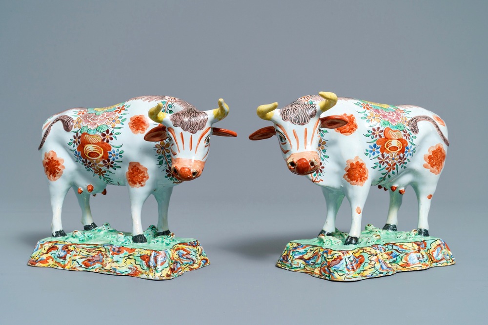 A pair of polychrome petit feu and gilded Dutch Delft models of cows, 1st half 18th C.