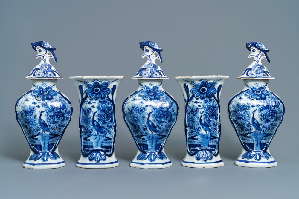 A Dutch Delft blue and white five-piece garniture with birds of paradise, 18th C.