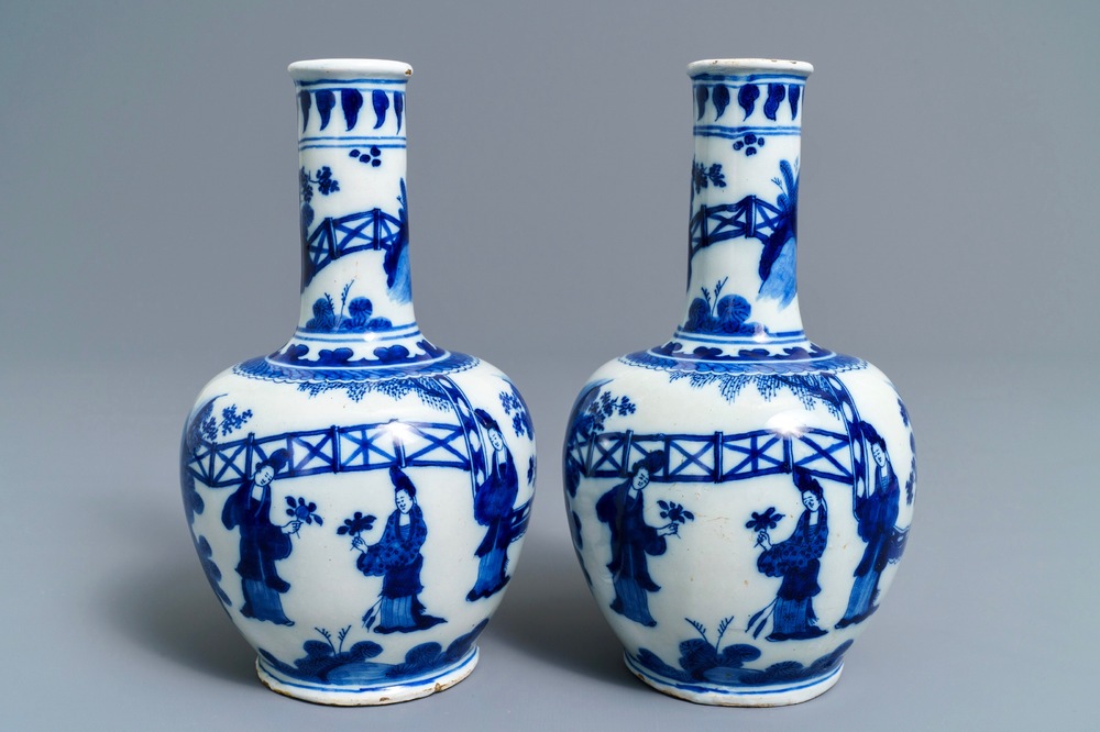 A pair of Dutch Delft blue and white chinoiserie bottle vases, 1st half 18th C.