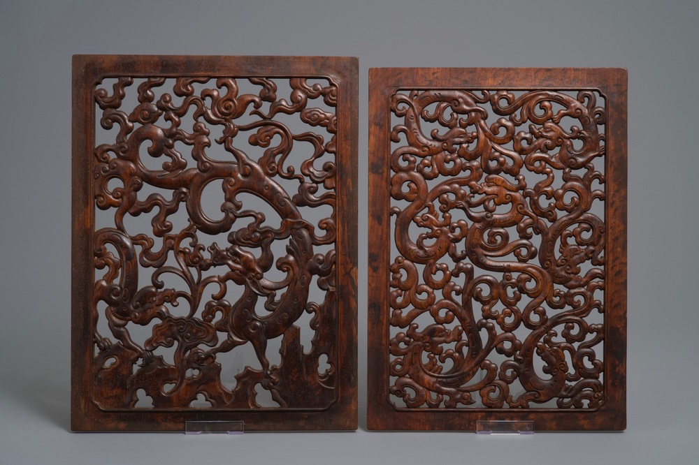 A pair of Chinese reticulated carved wooden panels, 18/19th C.